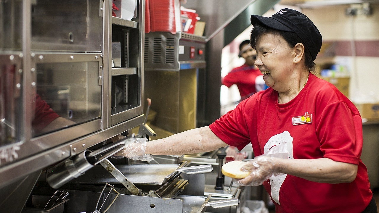 Having been on the job for 30 years, 71-year-old Lee Kwai Fong has become an expert at preparing KFC food items.