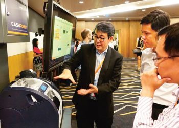 Certis CISCO President and CEO Paul Chong gives a presentation on the benefits of using technology to help cope with the manpower crunch in the security industry.