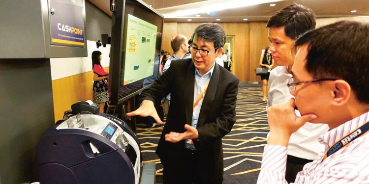 Certis CISCO President and CEO Paul Chong gives a presentation on the benefits of using technology to help cope with the manpower crunch in the security industry.