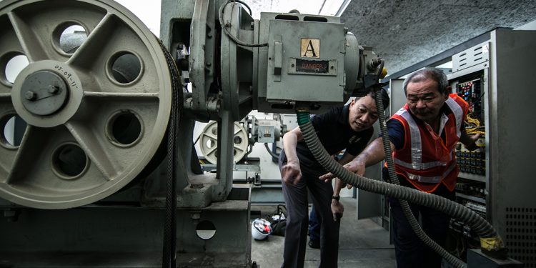 Understanding more about their work from 58-year-old, Patrick Tung, a lift technician (Photo Source: NTUC)