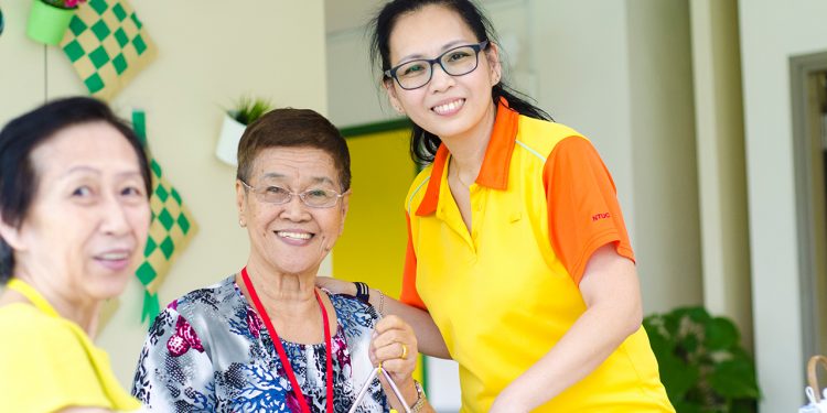 “I want to set a positive example to my children that we must always embrace learning and improve ourselves,” says NTUC Health Silver Circle Dementia Care Coordinator Sharon Kwek. (Photo Source: NTUC This Week)