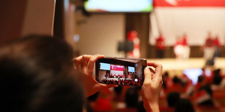 Capturing the mood and moment: Talented performers from nEbO, Young NTUC Play and ITE Central entertain the audience with a rendition of favourite National Day songs.