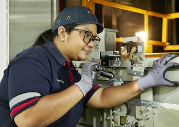 Nur Shafiqah Irwandy, 24, is one of the few female lift specialists at Fujitec, leading a team of technicians and thriving with the support of the Progressive Wage Model.