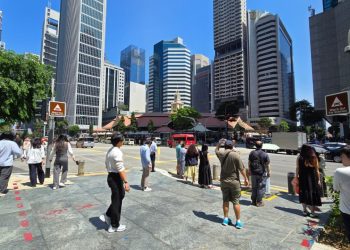 Workers in Singapore’s central business district; real wages grew 4 per cent in 2025 according to MOM’s Report on Wage Practices 2025.